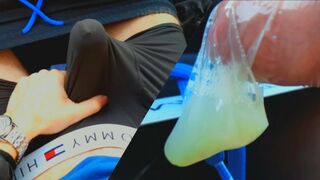 The man crammed the rubber to the top with seed while sitting in the van