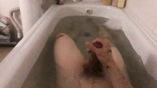 A youthful dude determined to have fun with his rod taking a tub