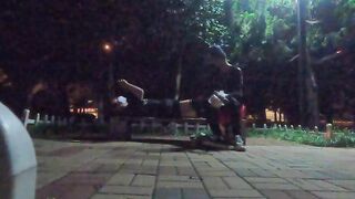 Man in dark-hued silk tempts passers-by on the side of the road for bj romp